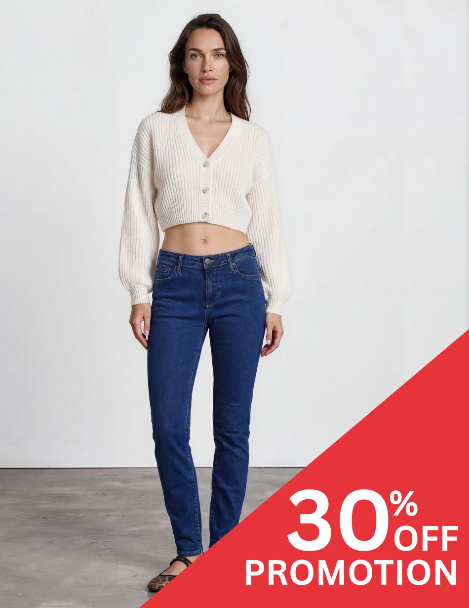 SHERI SLIM RINSE DIS Model wearing a cream cropped knit cardigan and blue jeans in a studio; red promotional overlay reads '30% OFF' in the corner