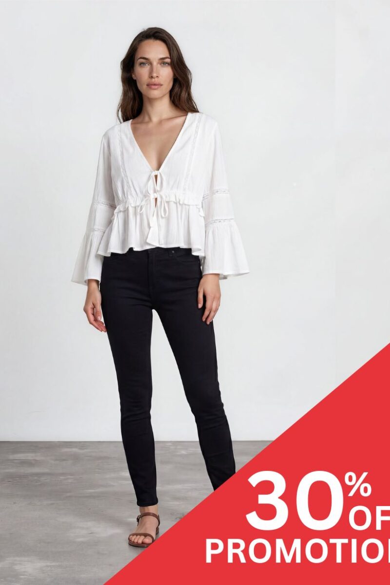 Model wearing a white V-neck peasant blouse and black skinny jeans stands against a plain light background with a red 30% OFF promotion banner in the corner.