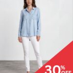 Model wearing a light blue button-down shirt and white jeans against a plain background with a red 30% OFF promotion banner in the bottom-right corner.
