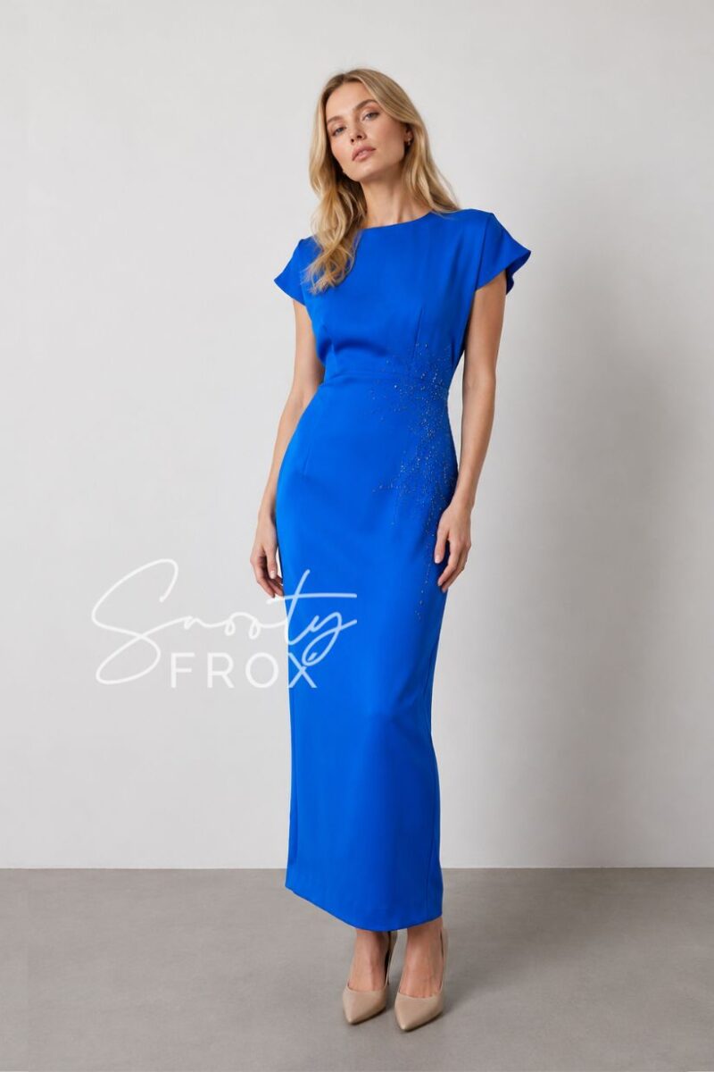 Full-length royal blue evening gown with cap sleeves and beaded waist on a model wearing beige pumps.