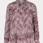 Button-front long-sleeve shirt with burgundy and white zebra stripes.
